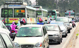 A view of traffic chaos on account of the ongoing road repair work near the flyover at Dera Bassi on Sunday.