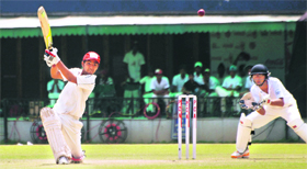 A batsman plays a shot during the match between Mohali and Chandigarh of the Coca Cola Cup at the PCA Stadium in Mohali on Sunday.
