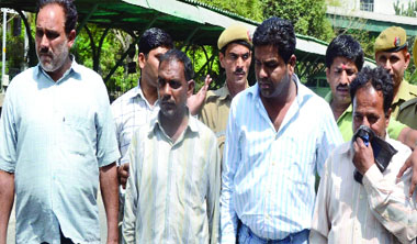The accused in police custody. 