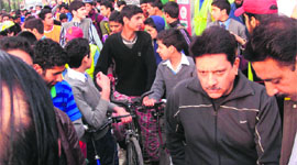 Participants get ready for the cycle race in Srinagar on Sunday.