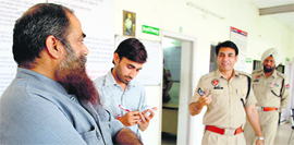 Shiv Sena leader Viney Jalandhari (left) in the police custody in Jalandhar on Sunday.