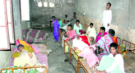 Women lie huddled together at the female ward of Guru Nanak Anaath Ashram in Budhiana village of Jalandhar.