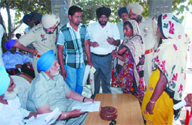 Janmeja Singh Sekhon listening to the problems of villagers during his thanksgiving trip to Maur Assembly Constituency on Monday. 