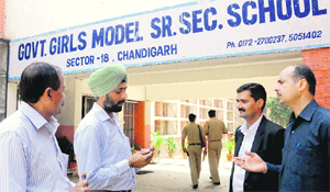 Parents protest against their children being detained in Class XI outside the GGSSS-18 in Chandigarh on Monday.