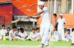 A player plays a match in progress in Chandigarh on Monday.  