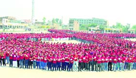 Residents and students form a Red Ribbon, claimed to be the worlds largest, in Karnal on Monday