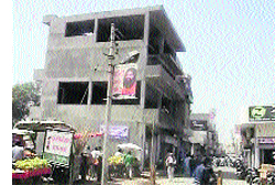 A commercial building coming up on a road in Jind.