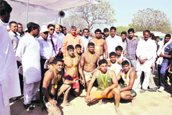 Chief Parliamentary Secretary Dharambir Singh poses with Sonepat kabaddi (men) team, the winner in the Haryana State Panchayat Sports Meet, at MNSS, Rai.