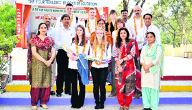 British students and teachers at GAV Public School, Kangra, on Monday.