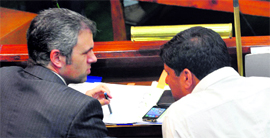 Chief Minister Omar Abdullah with National Conference MLA Nazir Ahmed Gorazi during the Assembly session on Monday.