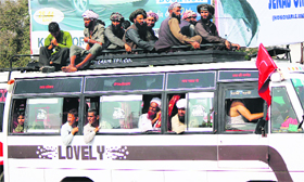 An overloaded mini-bus in Jammu.