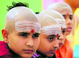 Young boys attend yagnopavit, a thread investiture ceremony, organised by the Akhil Bharatiya Vedic Dharam Prachar Ashram in Jammu on Monday.