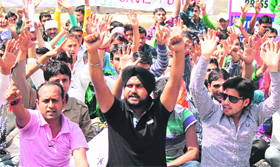 All-National Youth Corps workers protest in support of their demands in Jammu on Monday.