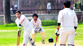A batsman plays a defensive shot during the Inter-Department Cricket Tournament at the University of Jammu on Monday.