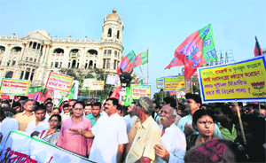 BJP activists stage a protest in Kolkata on Monday against the West Bengal Government's circular specifying select newspapers for subscription by state-sponsored and aided libraries