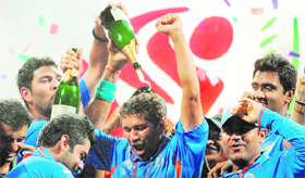 Sachin Tendulkar (C) celebrates with teammates after Indias World Cup win last year.