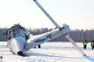 Police officers stand near the tail of the French-Italian made ATR-72 passenger plane that crashed outside the Siberian city of Tyumen on Monday. 