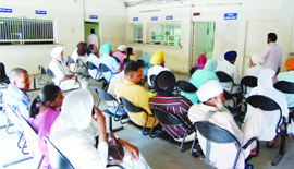 Applicants wait at the tehsildars office to get their properties registered. 