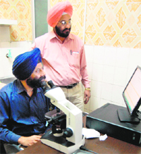 SMO Balbir Singh Dhillon gives instructions to staff at laboratories, which will be computerised from Wednesday. 