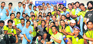 Players from India and Pakistan strike a pose during the Dosti Cup at the Shivalik Public School in Mohali on Tuesday