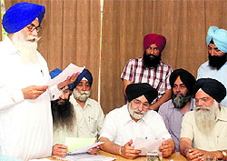 Sikander Singh Malooka (sitting centre) at the school board office in Mohali on Tuesday