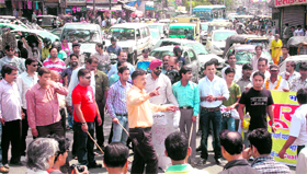 Striking jewellers block traffic at the Clock Tower in support of their demands in Dehradun on Tuesday.