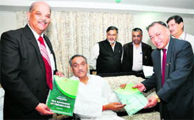 Chief Minister Vijay Bahuguna releases a study paper on ASSOCHAM agenda for the new government of Uttarakhand along with DS Rawat (right), secretary-general, ASSOCHAM, and UK Joshi, Director in Dehradun on Tuesday