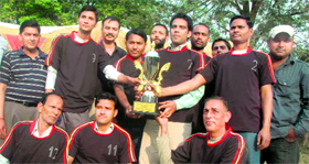 The winners with the trophy of a volleyball tournament in Dehradun on Tuesday.