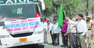 The bus carrying teachers on an educational tour being flagged off in Rajouri on Tuesday.