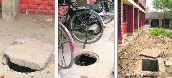 A partially covered manhole near the TB department and open manholes at Lord Mahavir Civil Hospital in Ludhiana