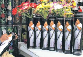 Flower pots bearing pictures of West Bengal Chief Minister Mamata Banerjee at a fair in Siliguri on Tuesday