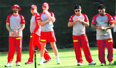 Kings XIs assistant coach Vikram Rathore, fieldiing coach Mike Young, captain-cum-coach Adam Gilchrist, Piyush Chawla and Ramesh Powar during a training session at the PCA Stadium in Mohali on Tuesday.