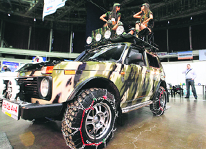 Models pose during the presentation of the Russian made Niva- Rys (Niva- Lynx) heavy-duty SUV, which costs about US $16,000, at the World of the Automobile 2012 international car exhibition in St. Petersburg on Wednesday.