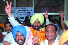 Ranjit Singh Jalal celebrates after being chosen the president of the District Bar Association in the election held in Bathinda on Wednesday.