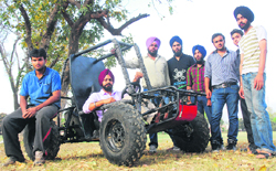 Students of the PEC University of Technology stand beside their All Terrain Vehicle on the college campus in Sector 12, Chandigarh