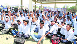 Workers of the Rockman factory from Haridwar stage a protest in support of their demands at the Parade Ground in Dehradun