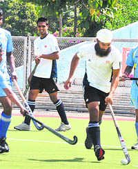 Players of ONGC team and GAIL team during the inaugural match of 30th PSPB Hockey Tournament in Jalandhar on Wednesday. 