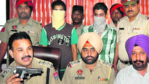 The accused students (covered faces) of Lovely Professional University in police custody in Jalandhar on Wednesday. 