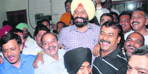 Gurnam Singh Pelia being lifted by his supporters after being elected president of the District Bar Association in Jalandhar on Wednesday. 
