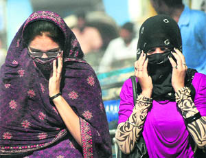 Girls cover their faces as the mercury rises and the sun gets cruel with every passing day in Jalandhar.