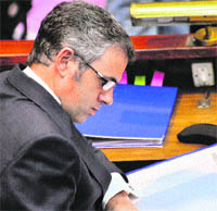 Chief Minister Omar Abdullah goes through some documents in the Assembly on Wednesday.