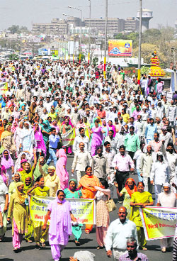 West Pakistan refugees hold a rally in support of their demands at Bikram Chowk in Jammu on Wednesday.