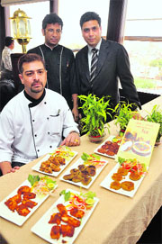 A chef displays his creations during the Awadhi Food Festival at a hotel in Jammu on Wednesday