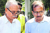 Bureaucrats Ramanand Tiwari (L) and Jayraj Phatak at a court in Mumbai on Wednesday