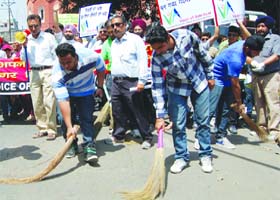 Members of the Voice of Amritsar take part in a cleanliness drive in Amritsar on Thursday