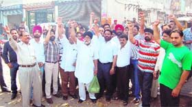 Residents hold a protest against the sale of drugs at Sudarshan Nagar in Amritsar on Thursday