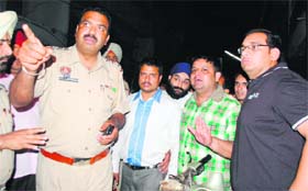 Police officials at the spot where two groups of jewellers clashed at Guru Bazaar in Amritsar on Thursday