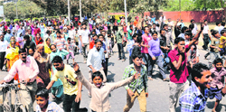 Residents of the Sector-25 colony hold a protest at the Sector 37-38 roundabout in Chandigarh