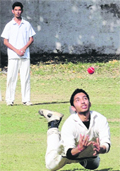 A fielder dives for a catch during a match of the Gully Cricket Tournament at St Johns School in Sector 26 of Chandigarh 