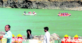 Two boats ply on the Ganga in the Kaudiyala-Rishikesh stretch adjacent to the Rishikesh- Badrinath national highway.